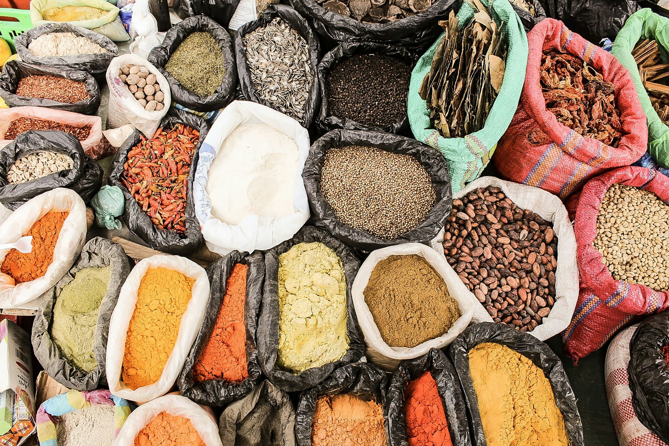 Open sacks of spices, seeds and powders